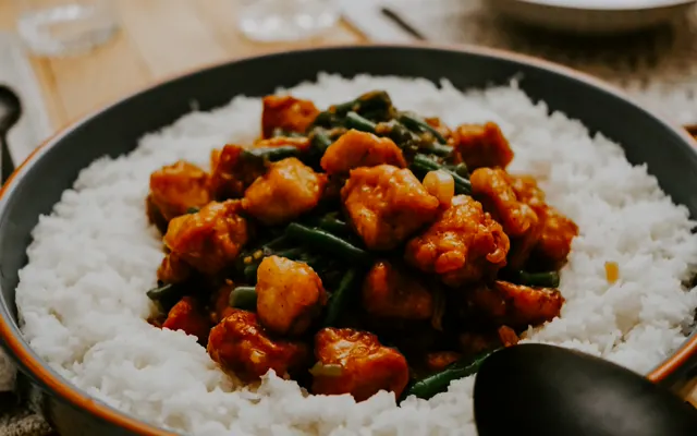 Crispy chicken in a sweet and spicy sauce over rice