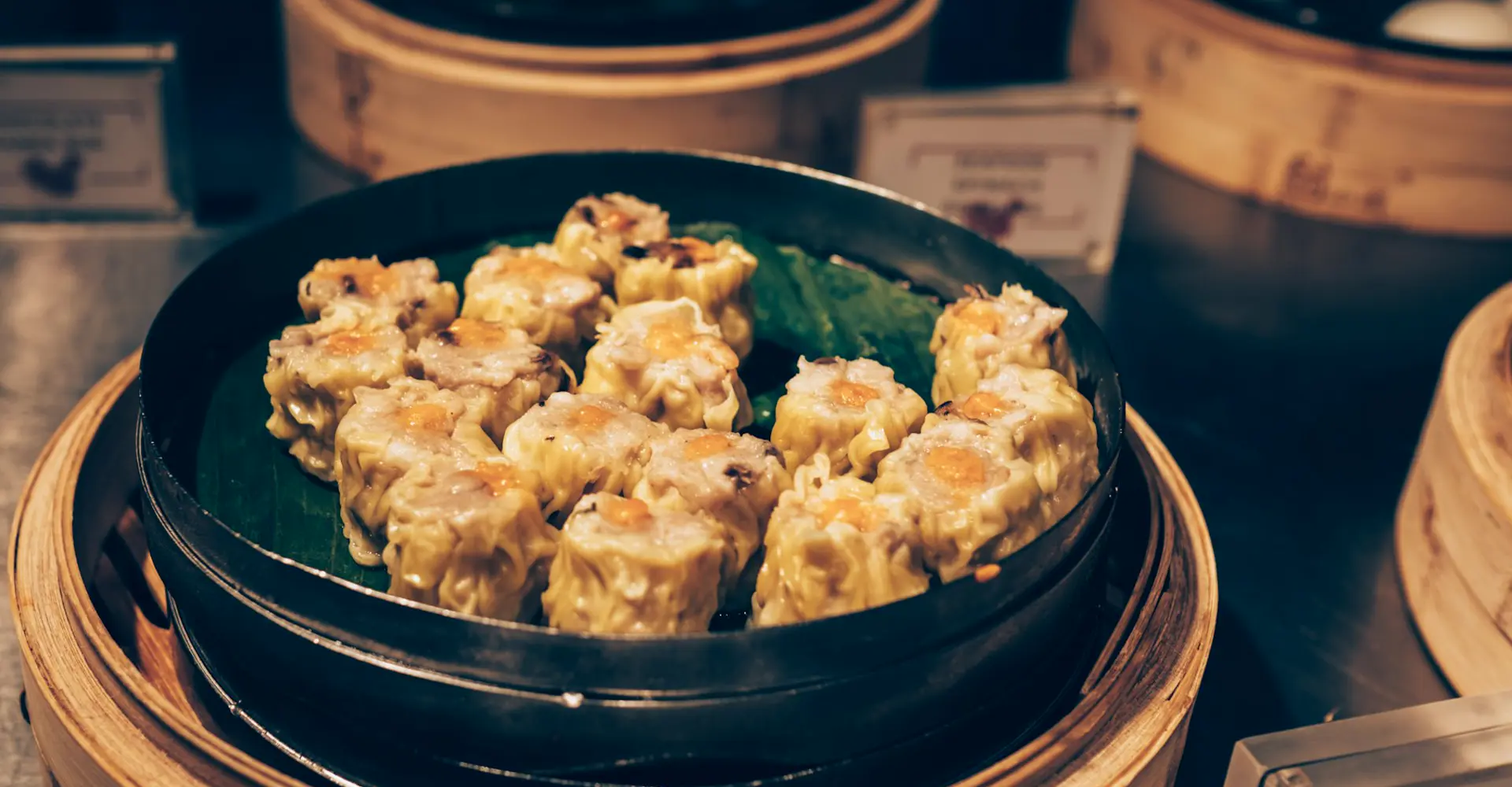 Siu mai dumplings in a bamboo steamer