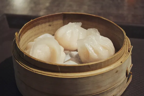 Shrimp dumplings in a bamboo steamer